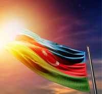 Azerbaijan national flag waving in dramatic dark sunlight