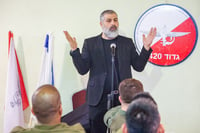 Zvi Yehezkeli, Channel 13 News reporter speaks with Israeli reserve soldiers from the Paratroopers Brigade who returned home after four and a half months, in Gush Etzion, in the West Bank, February 19, 2024. 