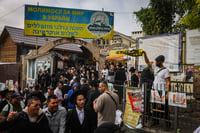 Jewish men in the street near the tomb of Rabbi Nachman of Breslov in Uman, on eve of Rosh Hashanah, October 2, 2024