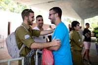 Families of young Israelis who enlisted to the "Netzah Yehuda" battalion say good-bye to the newly recruited soldiers at the Tel HaShomer millitary base