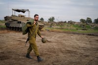 Israeli soldiers seen at a staging area near the Israeli border with Syria