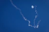 An Iron dome anti-missile system fires interception missile as rockets are fired from Lebanon