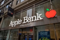 he exterior of an Apple Bank branch with the distinctive logo featuring a red apple.