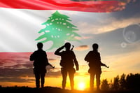 Soldier against Lebanese flag. Illustration.