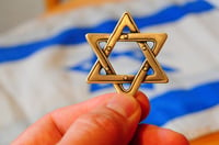 A Magen David (Jewish star hexagram) with Israeli flag on the background