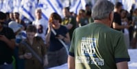 Man wearing a Brothers in Arms T-shirt