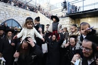 Jewish men dance during a special celebration marking the end of the jewish holiday of Hanukkah, at the Rashbi gravesite in Meron, Northern Israel, on January 2, 2025