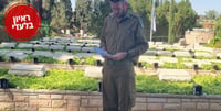 Soldier reciting prayers at a grave