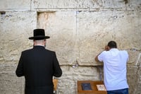 Jews pray at the Western Wall, Judaism's holiest prayer site in the Old City of Jerusalem, October 1, 2024. 