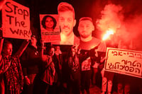 Demonstrators protest against the Israeli government and for the release of Israelis held hostage in the Gaza Strip outside Hakirya Base in Tel Aviv, January 11, 2025