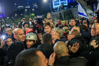 Demonstrators protest against the Israeli government and for the release of Israelis held hostage in the Gaza Stripc outside Hakirya Base in Tel Aviv, January 11, 2025. 