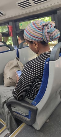 A woman sitting on a bus in Israel