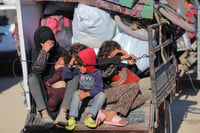 Displaced Palestinians make their way back to their homes in the northern Gaza Strip via Salah al-Din Road on January 28, 2025