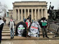  Pro-Palestinian protesters holding up images of Columbia University president Minouche Shafik and Barnard College president Laura A. Rosenbury at protest on campus