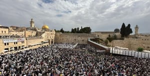 Tens of thousands pray at the blessing of the priests at the Western Wall. watch