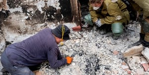 Archaeologists sifting through a different kind of ruins.