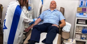 Luftwaffe commander donating blood.