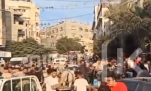 Watch: Hamas Activists Beat Residents Receiving Food Aid