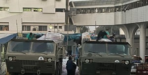 Delivering food and water supplies to Shifa Hospital.