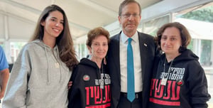 President Herzog and three of the released hostages.