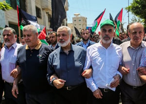 Hamas leaders in the Gaza Strip Ismail Haniya and Yahya Sinwar march during a protest against US President Donald Trump's “deal of the century” plan and the “Peace to Prosperity” conference in Bahrain, in Gaza City on June 26, 2019.