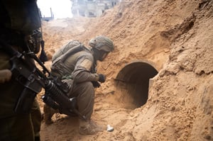 IDF soldiers in Gaza examining a tunnel shaft