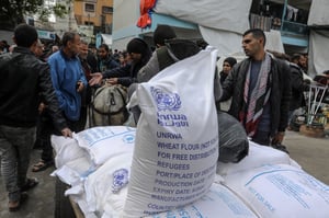 Increasingly cut out of the aid business. UNRWA aid distribution.