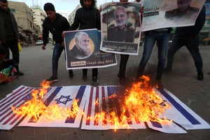 Palestinians burn American and Israeli flags following Soleimani's assassination