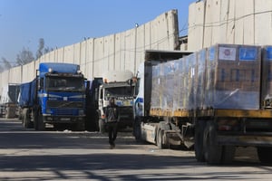 Trucks with aid arrive at the Palestinian side of the Kerem Shalom border crossing, in the southern Gaza Strip, on February 17, 2024. 
