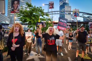 Demonstrators call for the release of Israeli hostages held in the Gaza Strip outside Hakirya Base in Tel Aviv, June 17, 2024. 