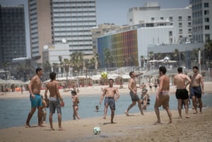 Israelis on the beach in Tel Aviv on a hot summer day. May 23, 2024. 