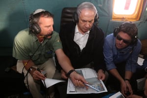 Prime Minister Benjamin Netanyahu (M) Shaul Goldst and Ofir Akunis (R) seen in the Arava area of South Israel.