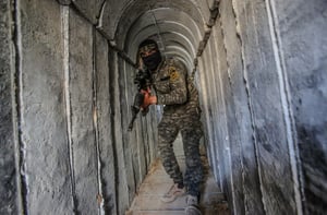 A Palestinian fighter of the Al-Quds brigades, the military wing of Palestinian Islamic Jihad (PIJ), seen inside a military tunnel in Beit Hanun, in the Gaza Strip.