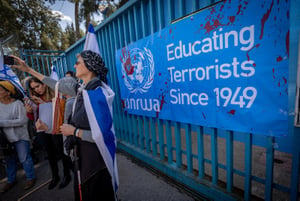 Activists protest against UNRWA outside their offices in Jerusalem