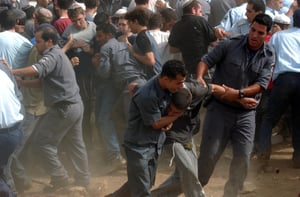 Israeli soldiers and police evacuate settlers from an illegal settlement