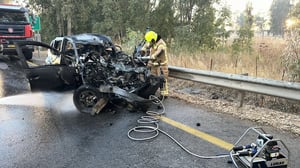 Firefighters at the scene of the Hezbollah attack