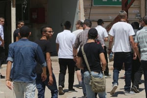 Ultra-orthodox Jewish men arrive at the Bakum Reception and Sorting base in Tel Hashomer