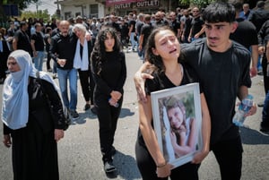 Family and friends attend the funeral service of druze children, Majdal Shams, in the Golan Heights, July 28, 2024. 