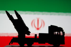 Military Missile Transport and Flag of Iran on the background