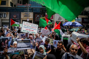 Palestinians f protest following the killing of Hamas leader Ismail Haniyeh in Iran, in the West Bank city of Hebron, August 3, 2024.