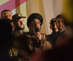 Lebanese Hezbollah chief Hassan Nasrallah, center