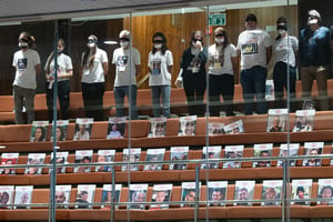 Hostage families protesting in Knesset balcony.