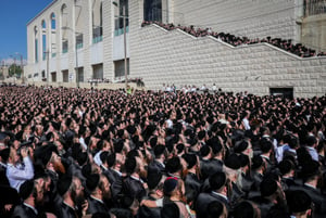 Ultra-Orthodox Jewish men attend the wedding of Rabbi Yaakov Aryeh Alter's granddaughter in Jerusalem on June 6, 2023 