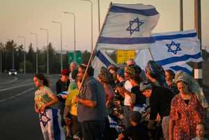 Israelis gather with national flags at 100 locations nationwide to strengthen the country's unity, Hispin, Golan Heights, on August 8, 2024.