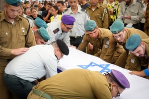 Family and friends attend the funeral of IDF Sergeant Daniel Aviv Haim Sofer, 19, at the military cemetery in Ashkelon