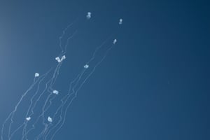 An anti-missile system fires interception missiles as rockets fired from Lebanon, as seen from Hula Valley