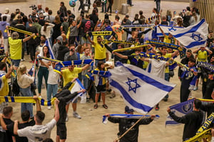 Israeli soccer fans are relieved after arriving back from Holland