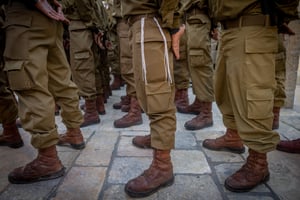 Israeli soldiers from Netzah Yehuda Battalion attend a swearing-in ceremony at the Western Wall in Jerusalem's Old City, on July 10, 2024. 