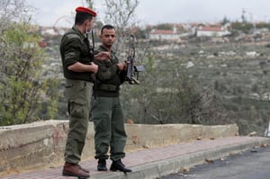 Palestinian village of Kfar Yasuf in the West Bank. In the background is seen the Jewish settlement of Har Bracha