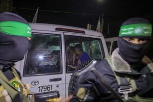 Members of the Hamas and the Islamic Jihad release Israeli hostages to the Red Cross, in Rafah, in the southern Gaza Strip, November 28, 2023